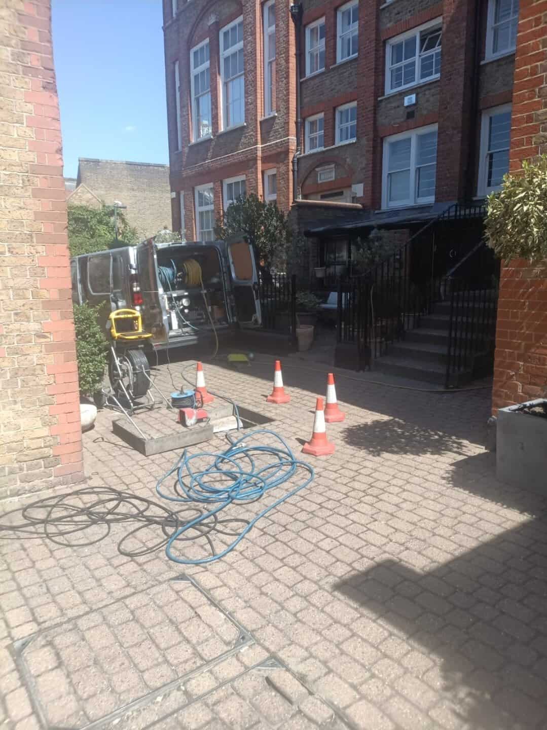 Drain inspection around patio and landscaping work.